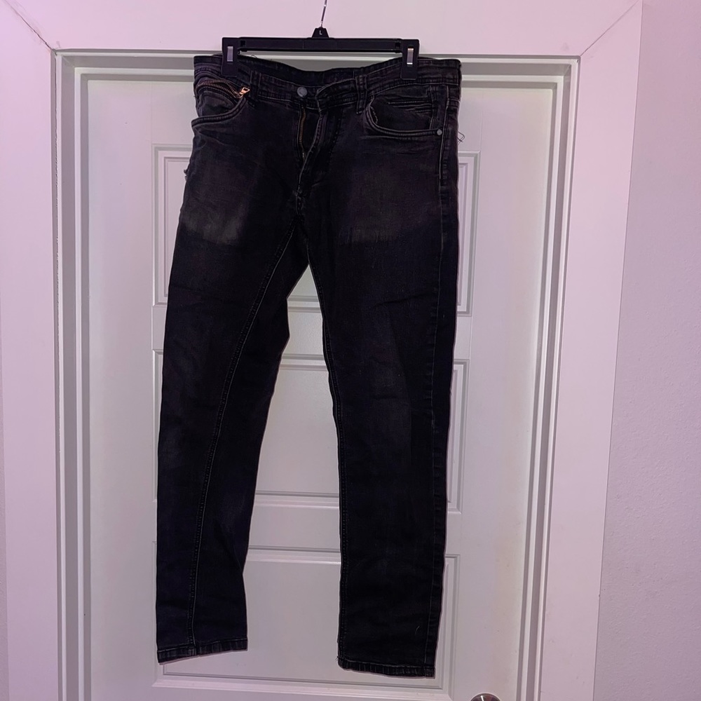 Worn black jeans.
